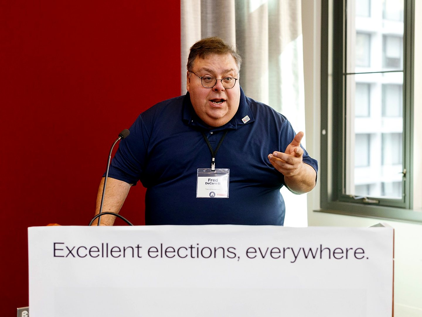 Fred DeCaro speaking at a lectern
